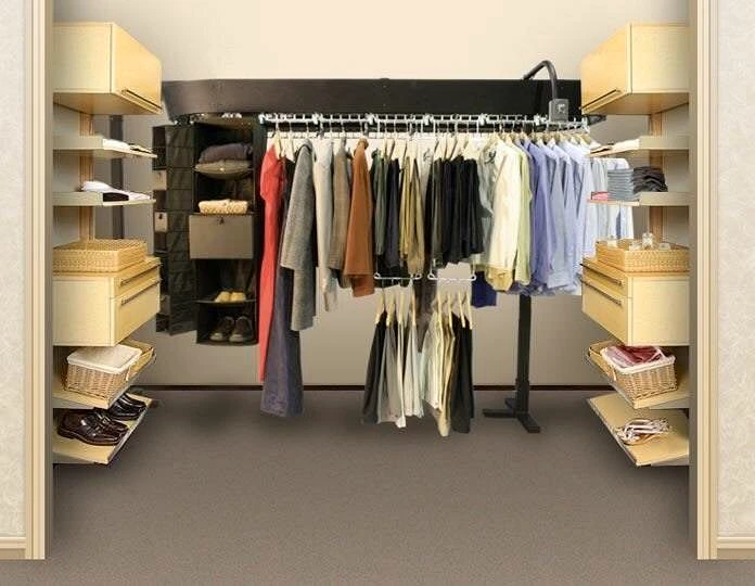 closet carousel room planning: Motorized clothes carousel installed in a walk-in closet