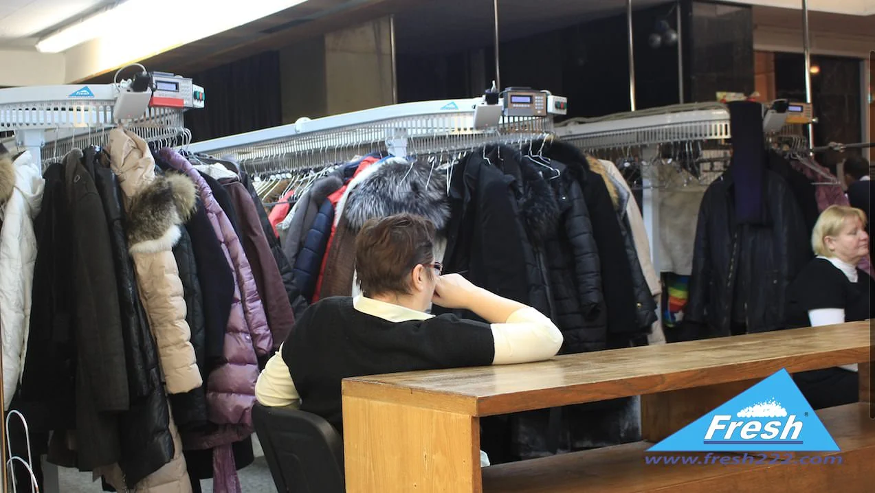 Real automated coat check and garment conveyor installation