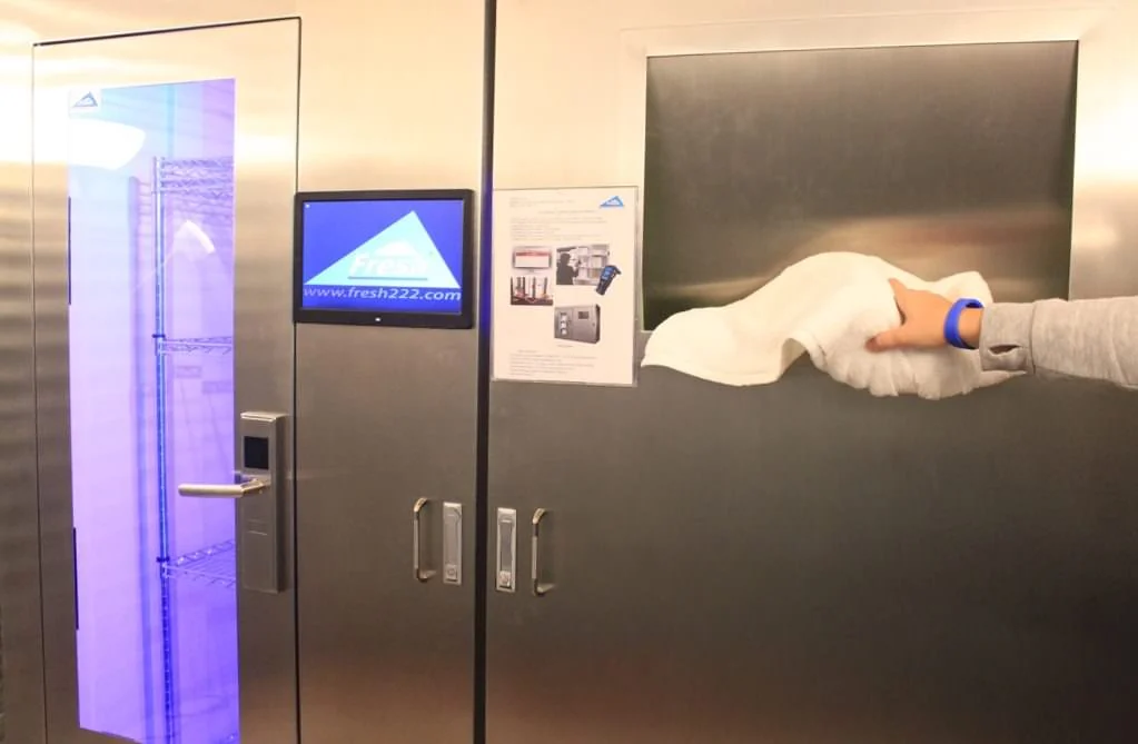 gym towel loss prevention: Controlled towel issue and return station in a gym or locker room